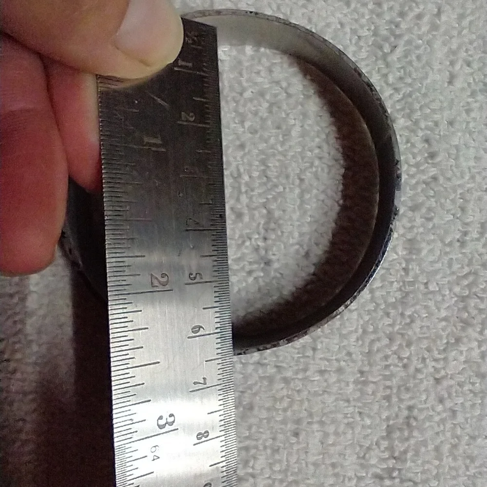 Silvertone black bangle bracelet approx. 2.5